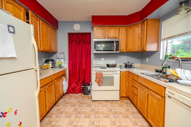 32904 Surow Dr, Warren, MI 48093 - kitchen featuring white appliances, a sink, light countertops, and brown cabinets