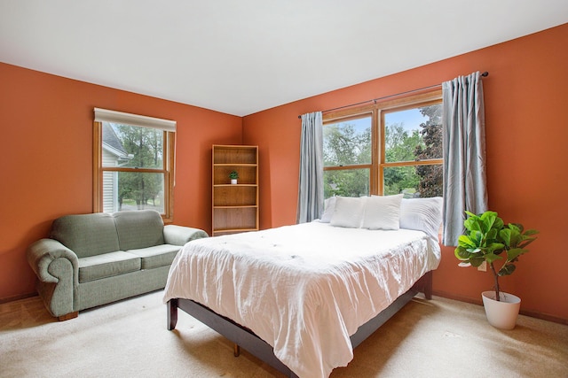 bedroom with carpet and baseboards