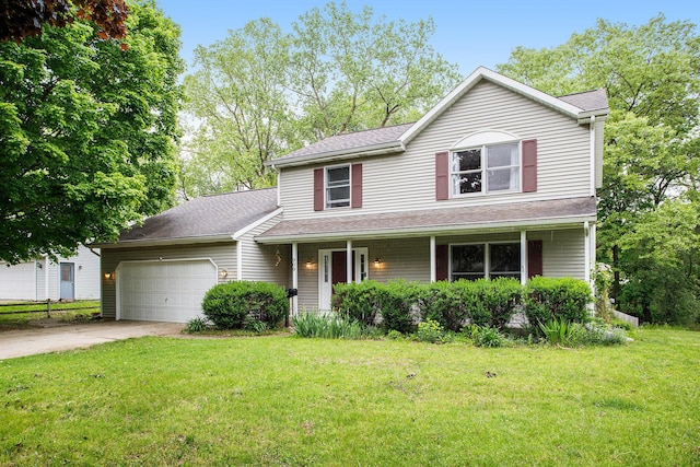 traditional-style home with an attached garage, driveway, a front lawn, and a porch