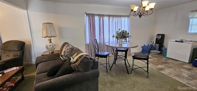 5471 Fairhaven St, Flint, MI 48505 - dining area with a chandelier, stone finish flooring, and baseboards