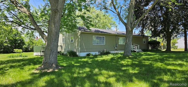 5471 Fairhaven St, Flint, MI 48505 - back of house with a yard and entry steps