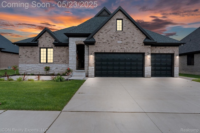 14153 Jode Park, Utica, MI 48315 - french provincial home with concrete driveway, an attached garage, a front lawn, and brick siding