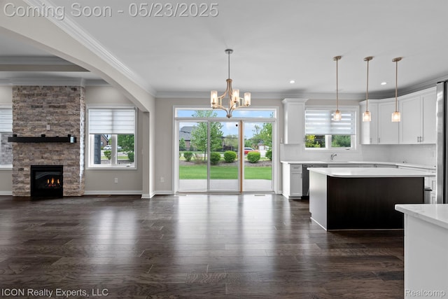 14153 Jode Park, Utica, MI 48315 - kitchen featuring open floor plan, crown molding, light countertops, white cabinets, and a chandelier
