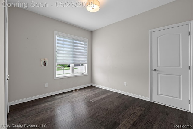 14153 Jode Park, Utica, MI 48315 - spare room with dark wood finished floors and baseboards