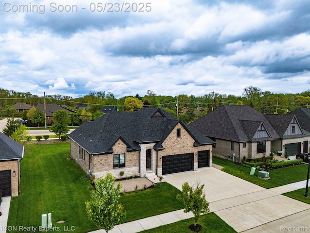 14153 Jode Park, Utica, MI 48315 - view of front of house featuring an attached garage, driveway, stone siding, and a front lawn
