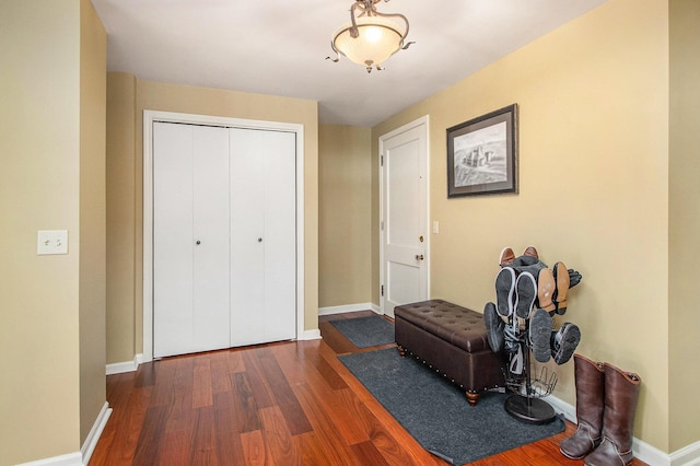 living area with dark wood finished floors and baseboards