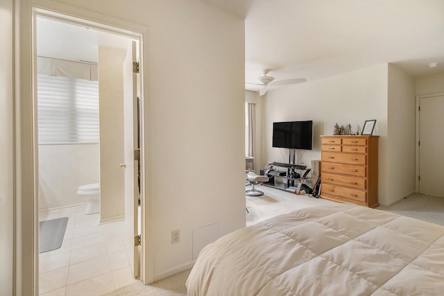 bedroom with baseboards and light tile patterned flooring