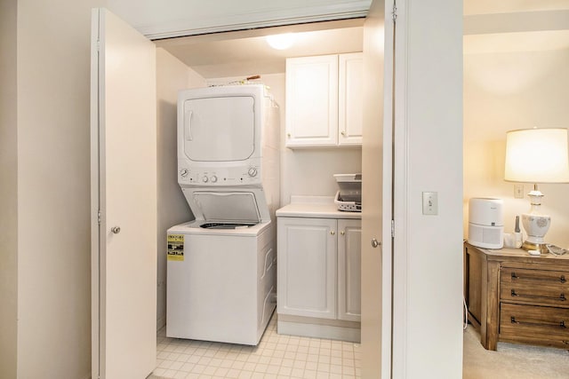 laundry area with stacked washer and clothes dryer