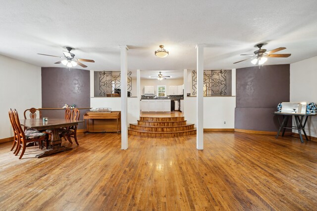 113 W Chicago St, Buchanan, MI 49107 - living room featuring light wood-type flooring, a ceiling fan, and baseboards