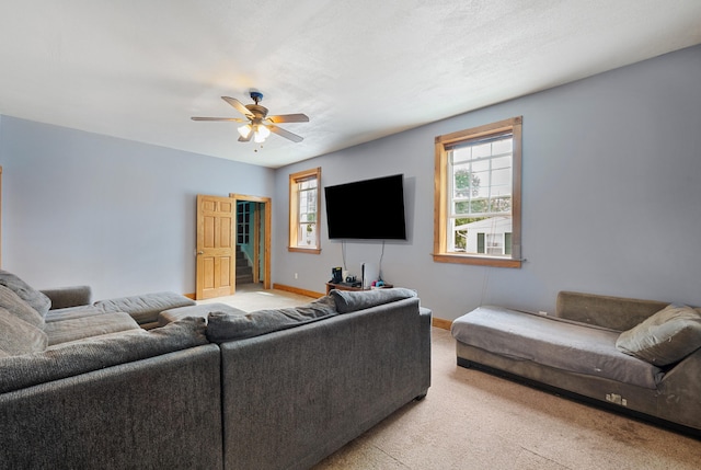 113 W Chicago St, Buchanan, MI 49107 - living area featuring light colored carpet, a ceiling fan, and baseboards