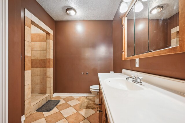 113 W Chicago St, Buchanan, MI 49107 - full bath featuring toilet, a textured ceiling, baseboards, vanity, and a shower
