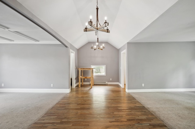 113 W Chicago St, Buchanan, MI 49107 - unfurnished living room featuring a chandelier, vaulted ceiling, wood finished floors, a baseboard heating unit, and baseboards