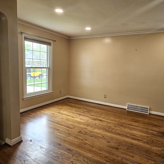 1381 Brys Dr, Grosse Pointe Woods, MI 48236 - unfurnished room with ornamental molding, arched walkways, dark wood-style floors, baseboards, and recessed lighting
