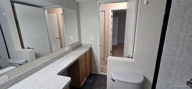 995 N Cass Lake Rd Unit 233, Waterford, MI 48328 - bathroom featuring toilet and vanity