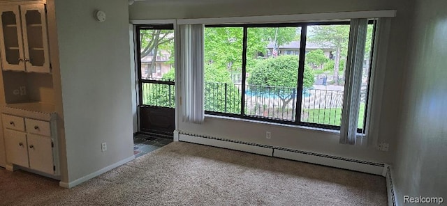 995 N Cass Lake Rd Unit 233, Waterford, MI 48328 - entryway with carpet, baseboard heating, and plenty of natural light