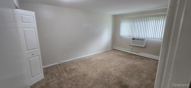 995 N Cass Lake Rd Unit 233, Waterford, MI 48328 - carpeted spare room featuring a baseboard heating unit, baseboards, and a wall unit AC