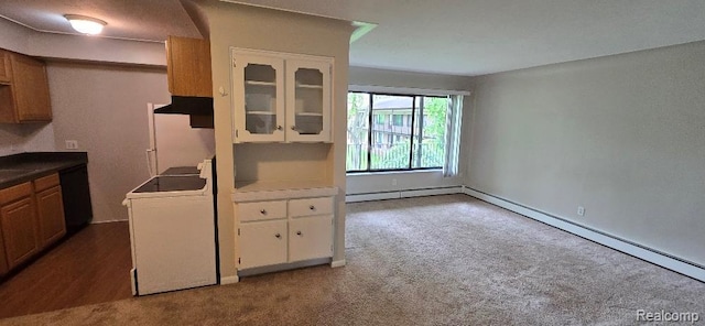 995 N Cass Lake Rd Unit 233, Waterford, MI 48328 - kitchen featuring washer / clothes dryer, a baseboard heating unit, white cabinetry, and dark carpet