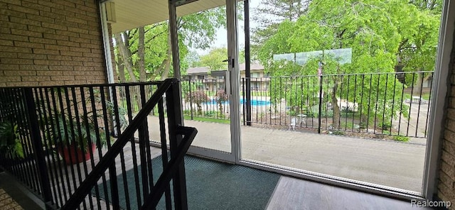 995 N Cass Lake Rd Unit 233, Waterford, MI 48328 - entryway featuring brick wall