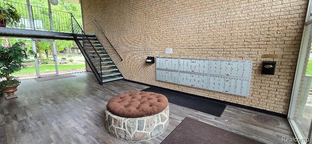 995 N Cass Lake Rd Unit 233, Waterford, MI 48328 - common area featuring a high ceiling and brick wall