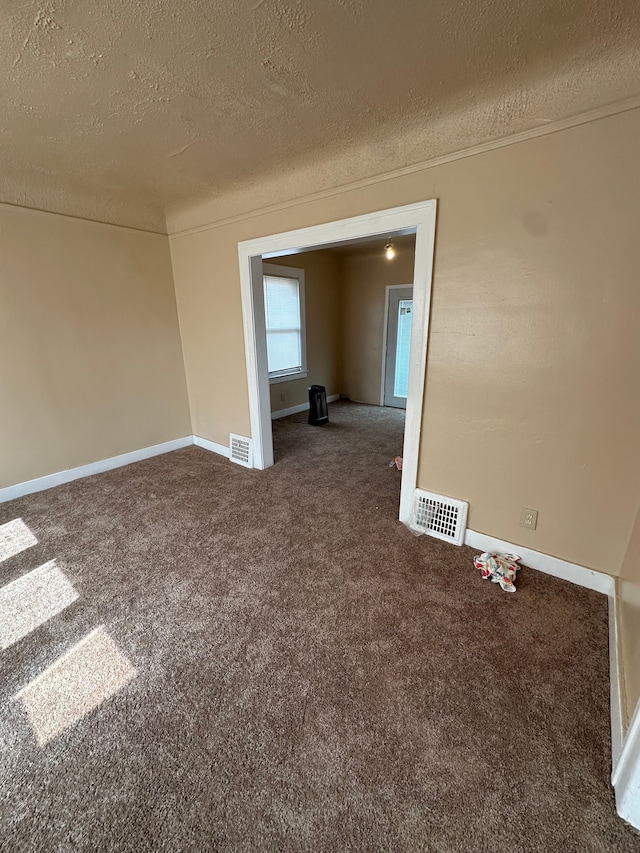 9982 Littlefield St, Detroit, MI 48227 - empty room with a textured ceiling, carpet floors, baseboards, and ornamental molding