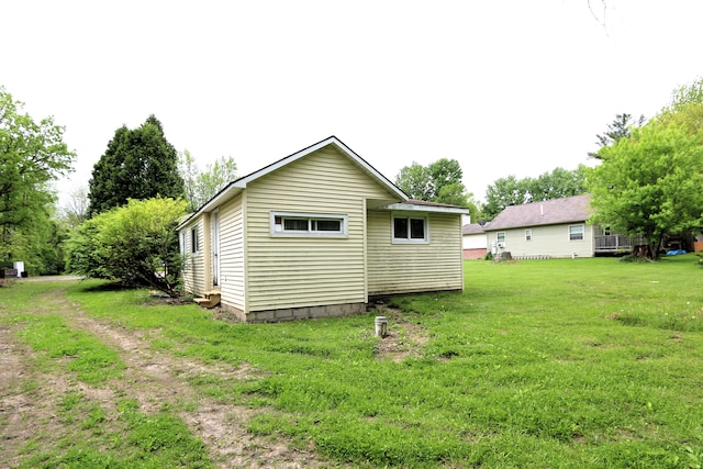 back of property with a yard