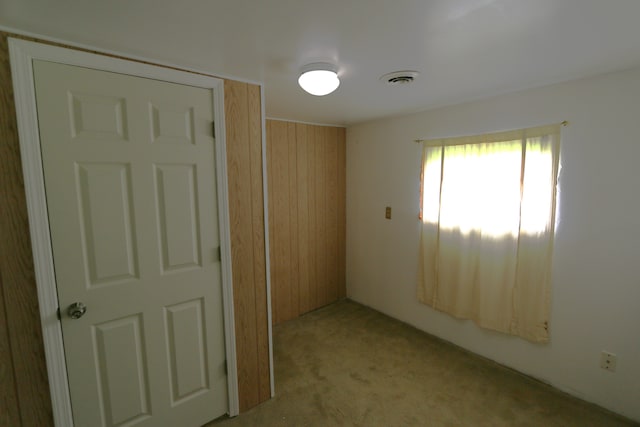 empty room with light colored carpet