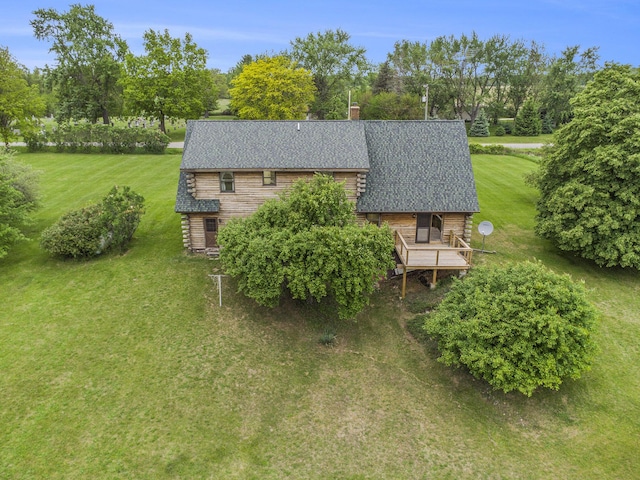 aerial view of property and surrounding area with a tree filled landscape