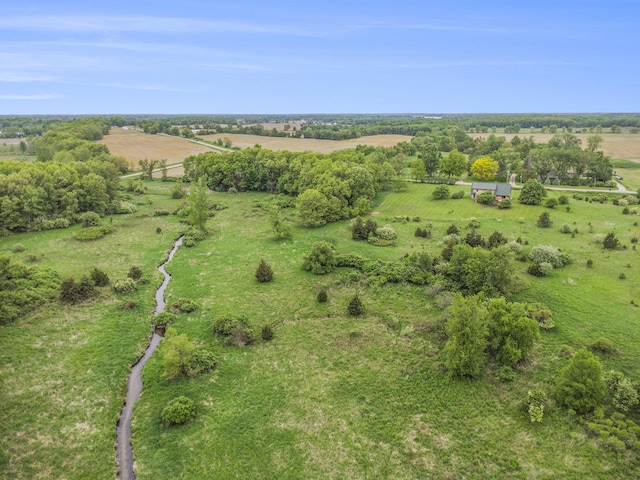 aerial view of property and surrounding area featuring rural landscape