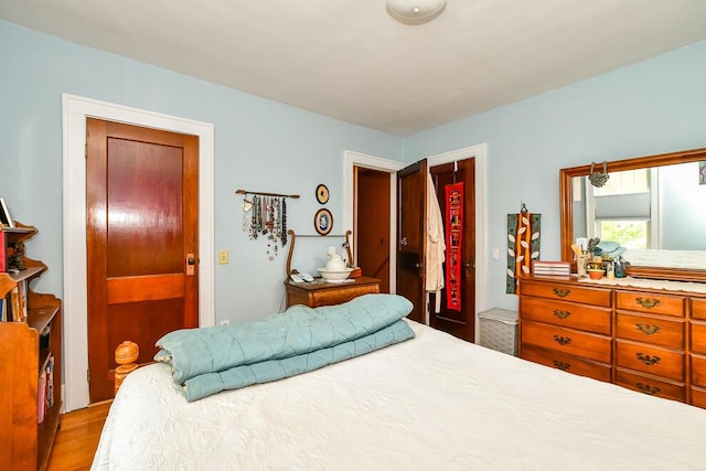 bedroom with light wood-style flooring