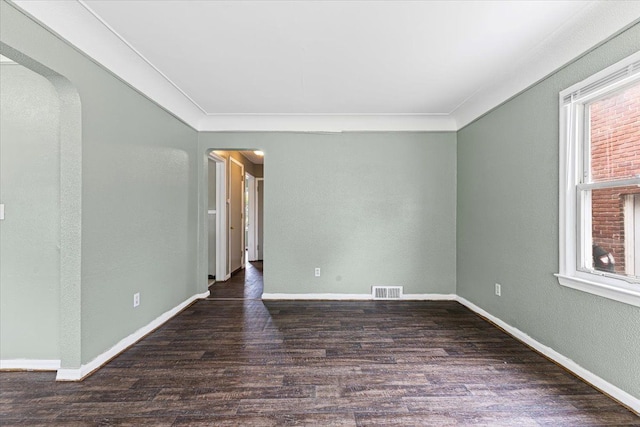 6905 Archdale St, Detroit, MI 48228 - spare room featuring arched walkways, wood finished floors, ornamental molding, and baseboards