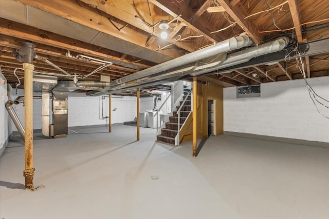 6905 Archdale St, Detroit, MI 48228 - unfinished basement featuring stairs, independent washer and dryer, and heating unit