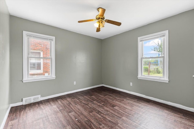6905 Archdale St, Detroit, MI 48228 - spare room with dark wood-style floors, baseboards, and a ceiling fan