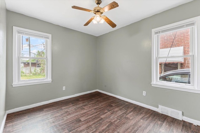 6905 Archdale St, Detroit, MI 48228 - empty room featuring dark wood-style floors, baseboards, and a ceiling fan