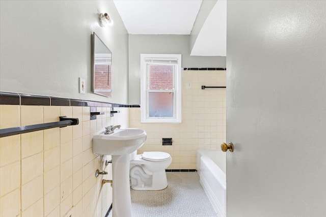 6905 Archdale St, Detroit, MI 48228 - full bathroom with tile walls, toilet, tile patterned flooring, and a wainscoted wall