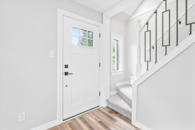 15016 Sunbury St, Livonia, MI 48154 - entrance foyer with stairway, wood finished floors, baseboards, and vaulted ceiling