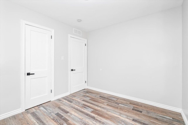 15016 Sunbury St, Livonia, MI 48154 - unfurnished bedroom with light wood-style flooring and baseboards