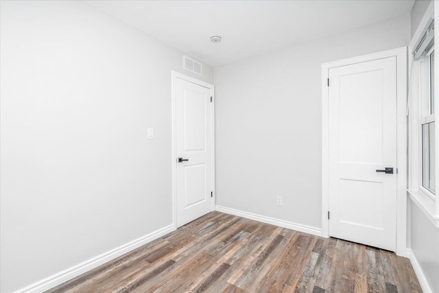 15016 Sunbury St, Livonia, MI 48154 - unfurnished bedroom featuring wood finished floors and baseboards
