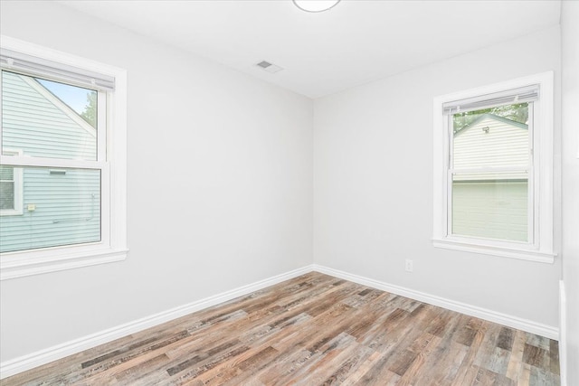 15016 Sunbury St, Livonia, MI 48154 - unfurnished room featuring wood finished floors, healthy amount of natural light, and baseboards