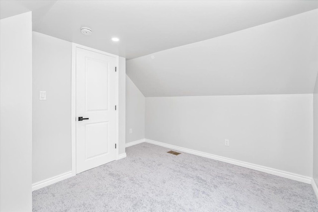 15016 Sunbury St, Livonia, MI 48154 - additional living space with vaulted ceiling, carpet, baseboards, and recessed lighting