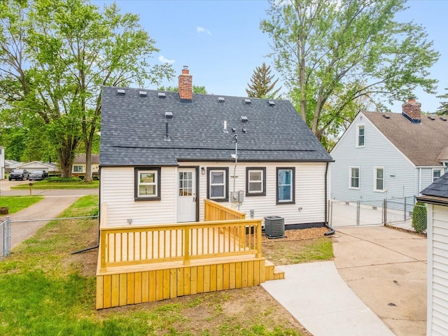 15016 Sunbury St, Livonia, MI 48154 - back of property featuring central AC, a gate, a shingled roof, and a deck