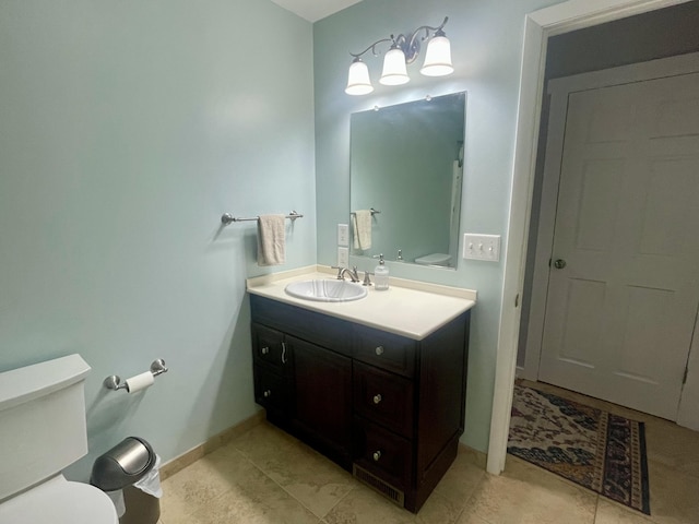19490 Island Lake Rd, Chelsea, MI 48118 - bathroom with toilet, vanity, and baseboards