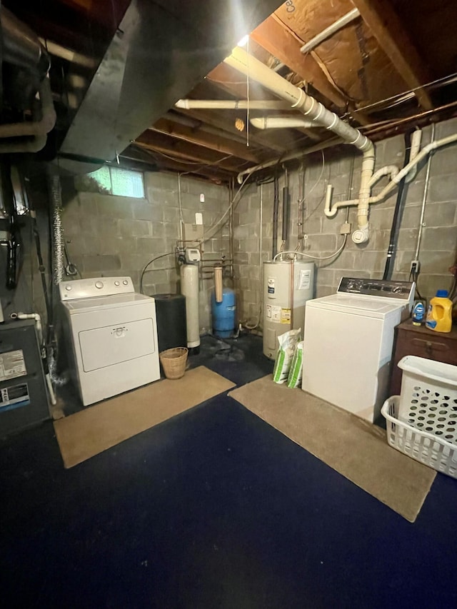 19490 Island Lake Rd, Chelsea, MI 48118 - basement featuring separate washer and dryer, water heater, a water pressure tank, and a water softener system