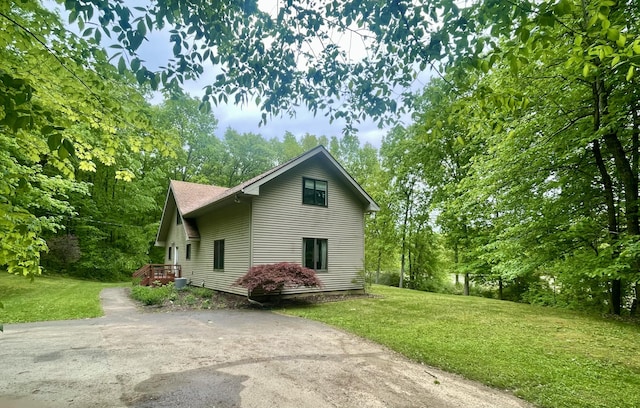 19490 Island Lake Rd, Chelsea, MI 48118 - view of side of home featuring a lawn