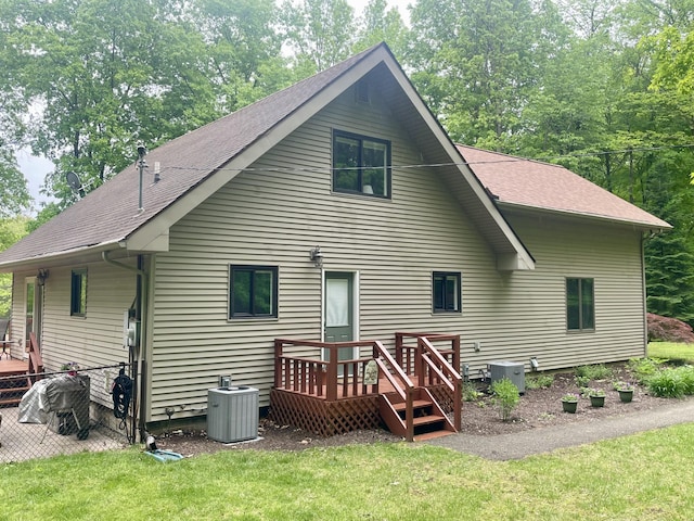 19490 Island Lake Rd, Chelsea, MI 48118 - rear view of property with a deck, central AC unit, and roof with shingles