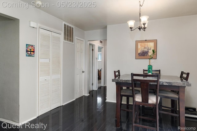 3680 Shoals St, Waterford, MI 48329 - dining room featuring dark wood finished floors, a chandelier, and baseboards