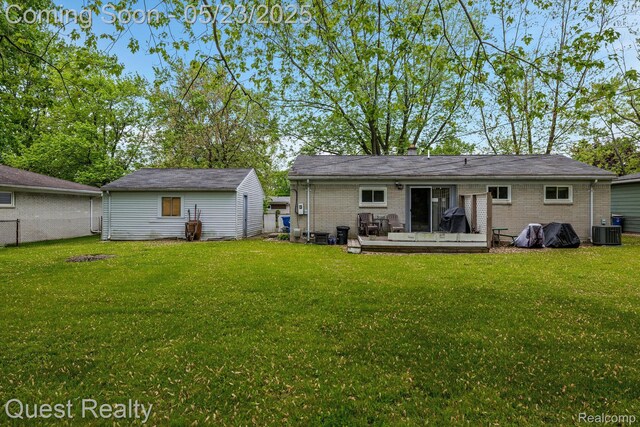 3680 Shoals St, Waterford, MI 48329 - back of property with brick siding, central AC unit, and a wooden deck