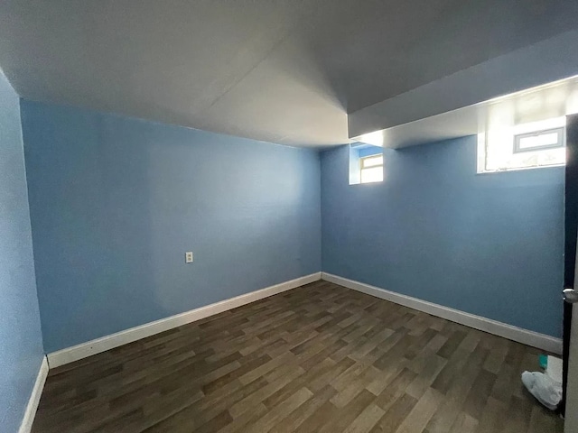 8056 Fisher Ave, Warren, MI 48089 - below grade area featuring dark wood finished floors and baseboards