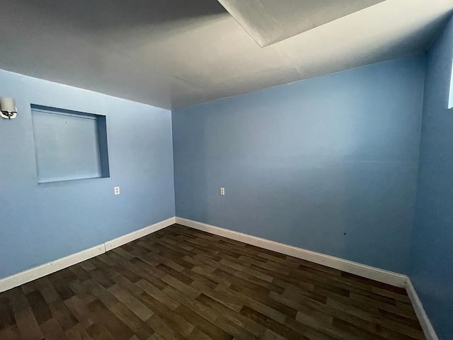 8056 Fisher Ave, Warren, MI 48089 - spare room featuring dark wood-type flooring and baseboards