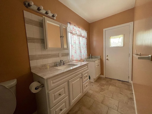 8056 Fisher Ave, Warren, MI 48089 - full bath featuring toilet, stone finish floors, and vanity