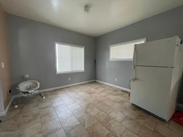 8056 Fisher Ave, Warren, MI 48089 - unfurnished dining area featuring baseboards